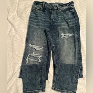 Button fly distressed jeans